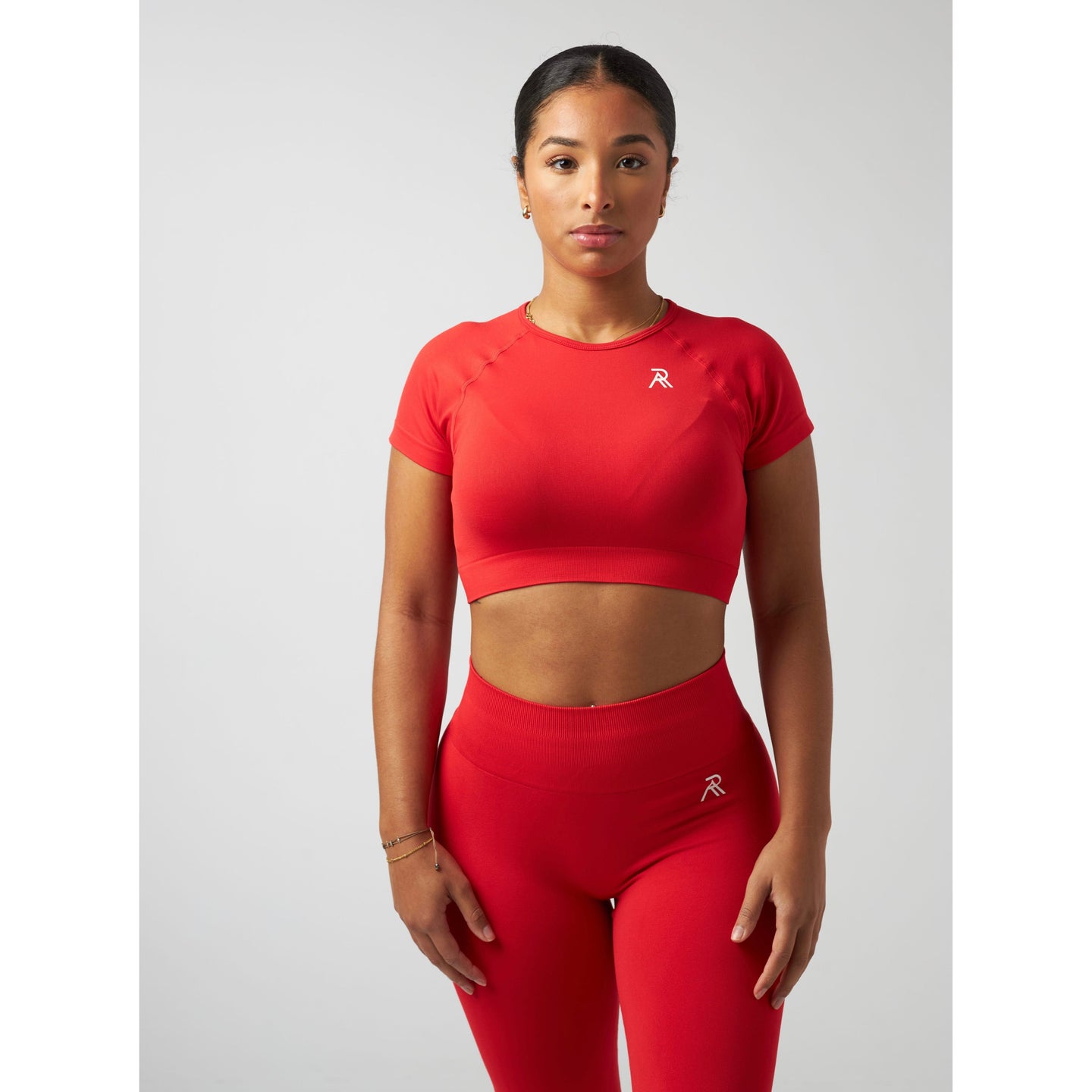 Elegant signature crop top designed for a stylish and modern look in contemporary fashion.